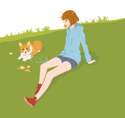 草むらと犬と女の子